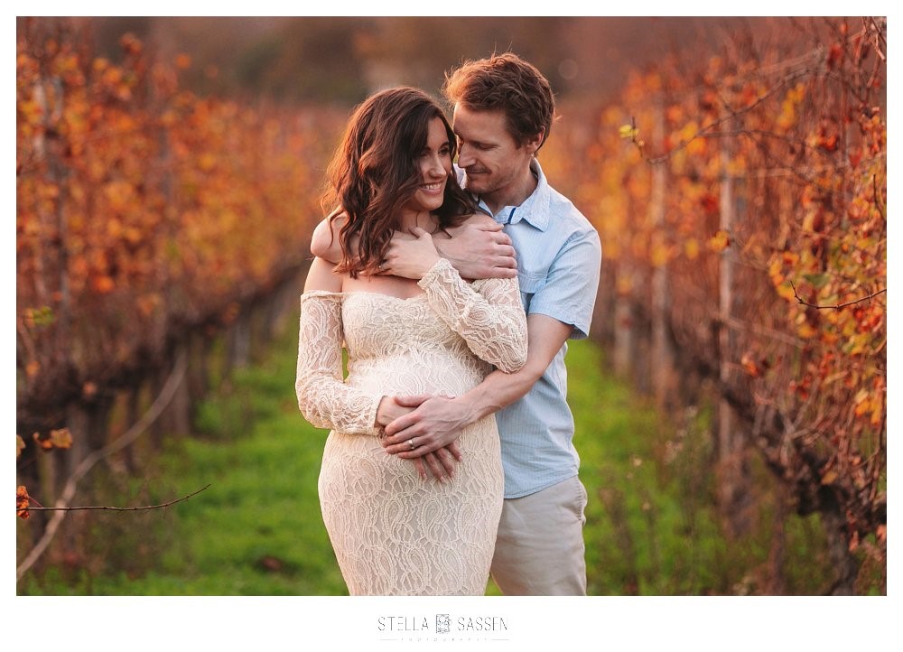 Maternity couple in vineyard during Autumn