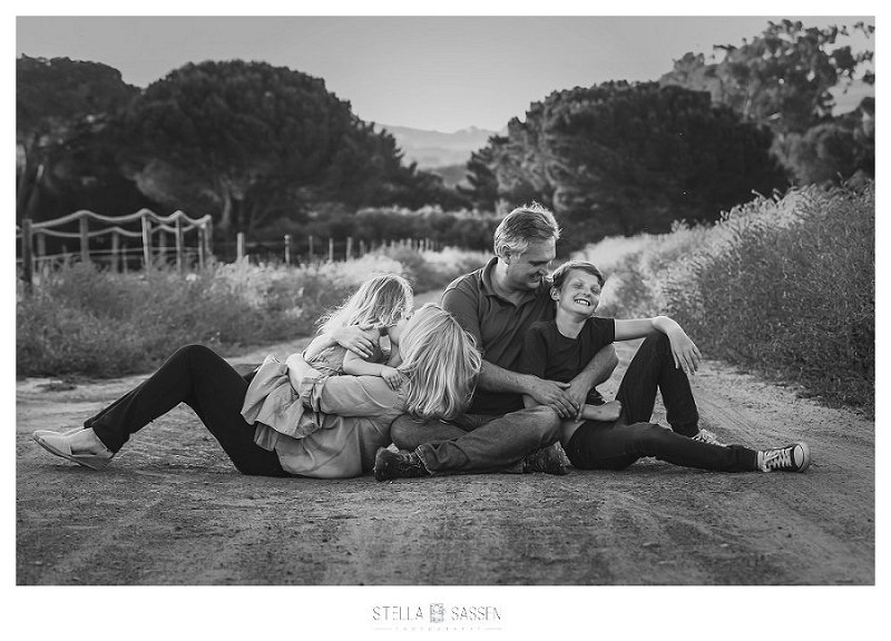 Casual family photo in gravel road with winelands in background