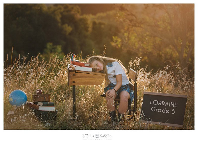 back to school photos in field at sunset