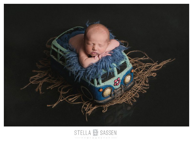 Newborn baby in prop for newborn shoot