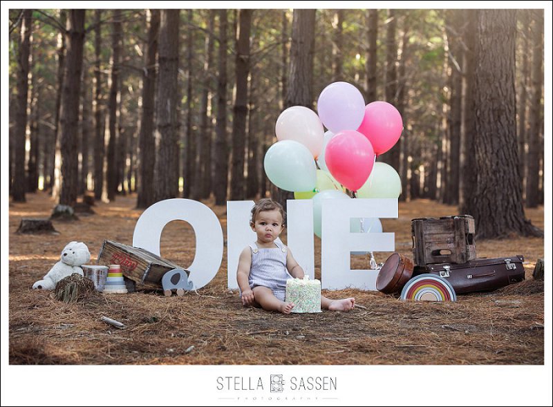 Outdoor cake smash with props in forest