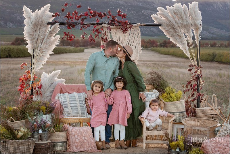 family photo in front of boho setup