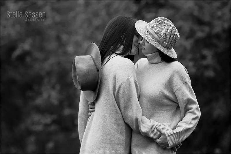 romantic image of same sex couple kissing at photoshoot