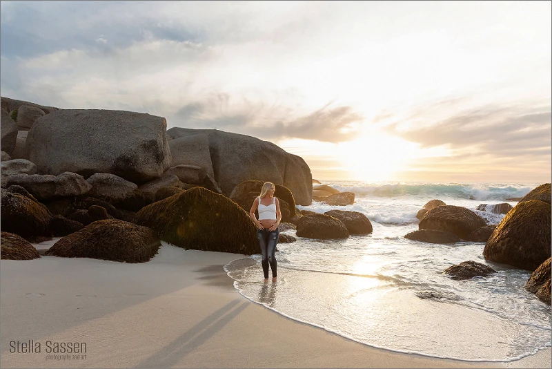 Maternity shoot on Cape Town beach at sunset with dramatic skies and golden light